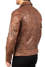 Brown leather jacket worn by a person on a white background