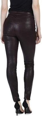 black leather pants worn by a person on a white background